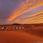 Sleeping under Sahara stars in Merzouga with luxury desert camp and Milky Way above Erg Chebbi dunes